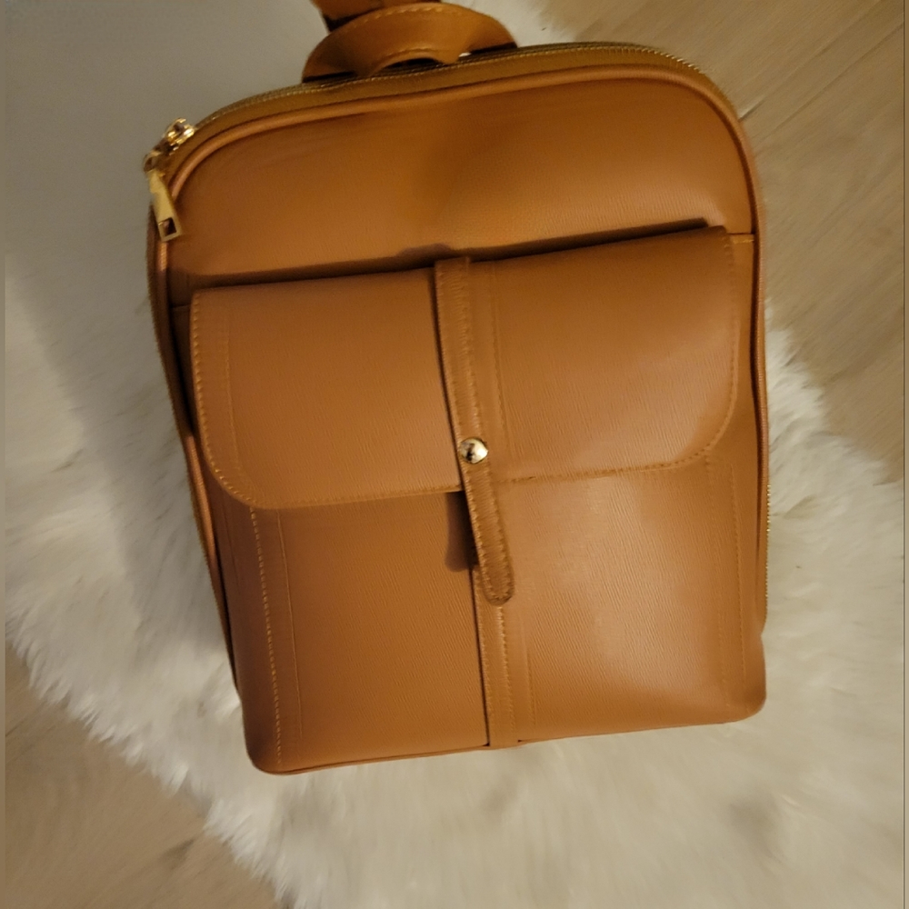 Tan semi-mini Backpack style purse.